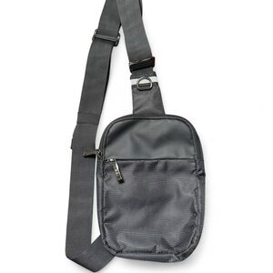Black sling Bag w/ adjustable straps and multiple pockets